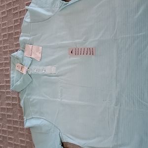 NEW TOMMY BAHAMA polo. Light Green. Size Medium.